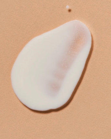 White moisturizer swatched on skin to show its creamy texture, skincare from LADA Beauty near El Paso